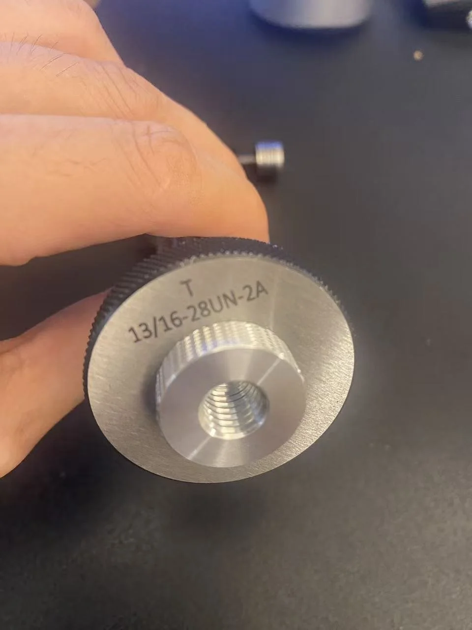 Calibrated Go thread ring gauge marked T 13-16-28UN-2A used to verify the external UN thread on the custom stud