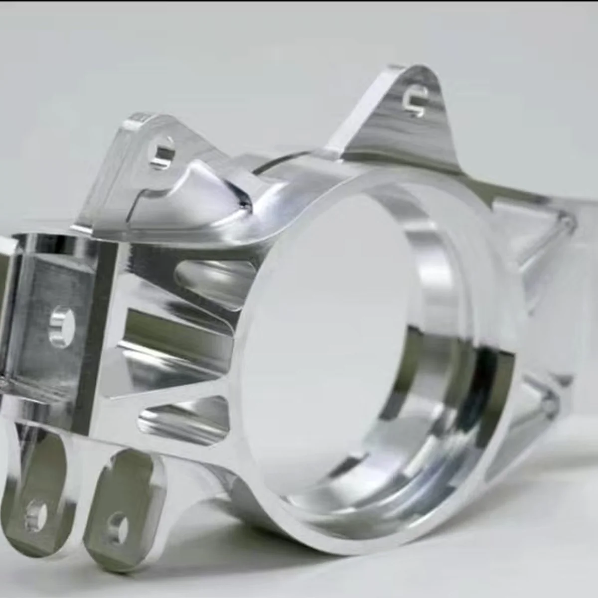 CNC machined aluminium sensor bracket with precise profile and mounting hole pattern by EKINSUN