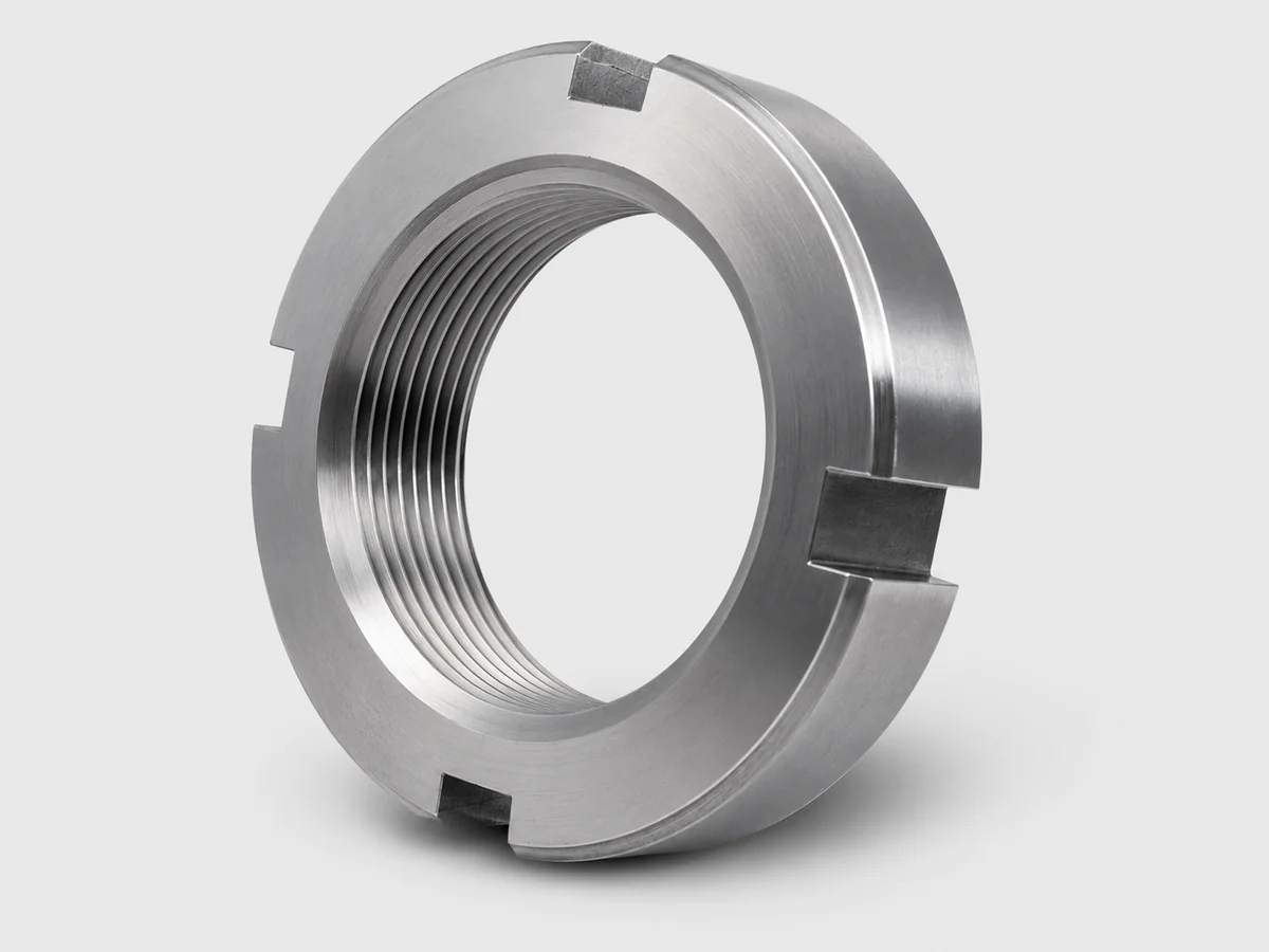 Custom KM-type round slotted bearing lock nut machined in stainless steel by EKINSUN, four face slots for a hook spanner