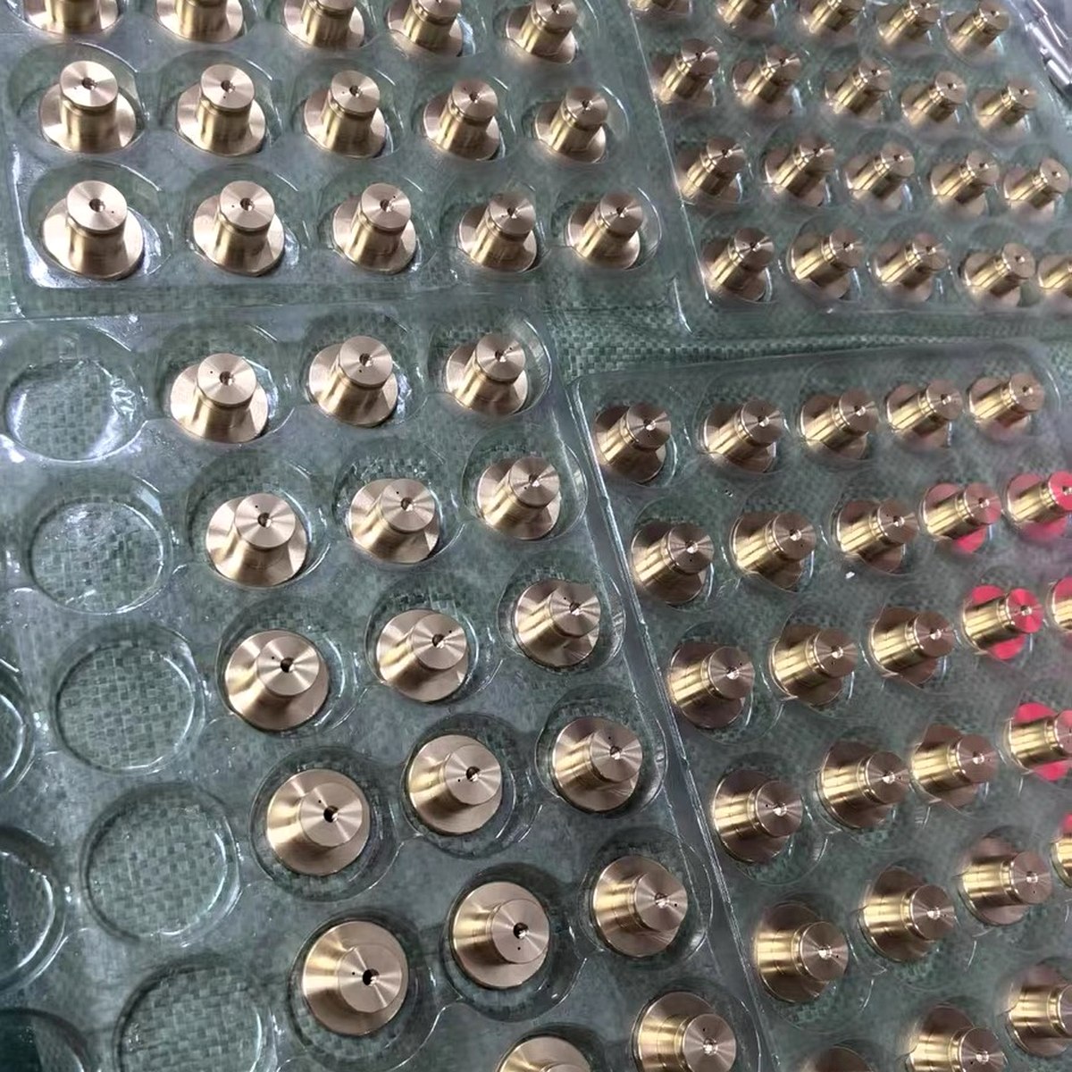 Brass precision parts packed in foam trays for export — EKINSUN Guangdong shipping
